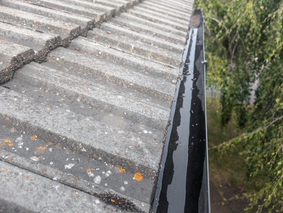 Moss and debris being vacuumed from the gutters at the Henley-on-Thames home