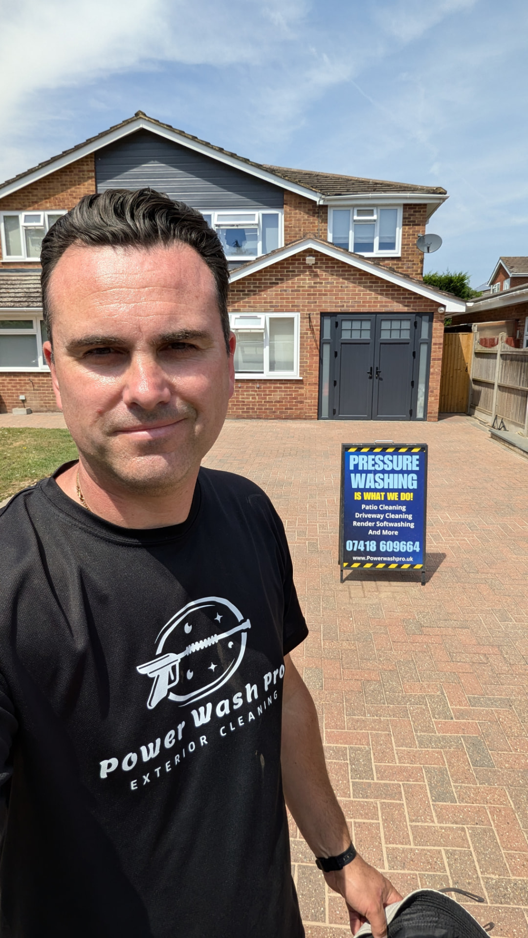 Andrew from Power Wash Pro in front of a freshly cleaned block paving driveway in Maidenhead