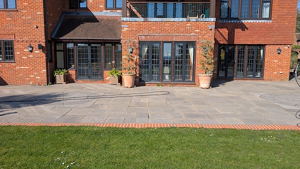 Clean patio after professional pressure washing showing even finish